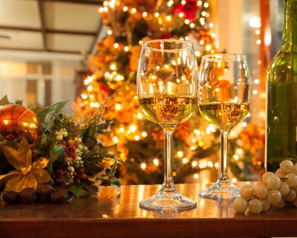 qtq80-Ge3R7K - DumpADate.com Two wine glasses are on a table in front of a christmas tree.